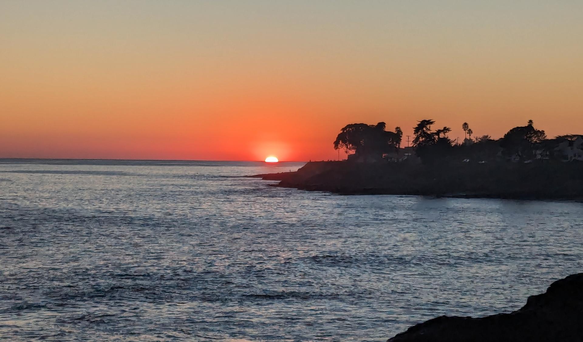 Sunset over the ocean and the West Cliff headland in Santa Cruz